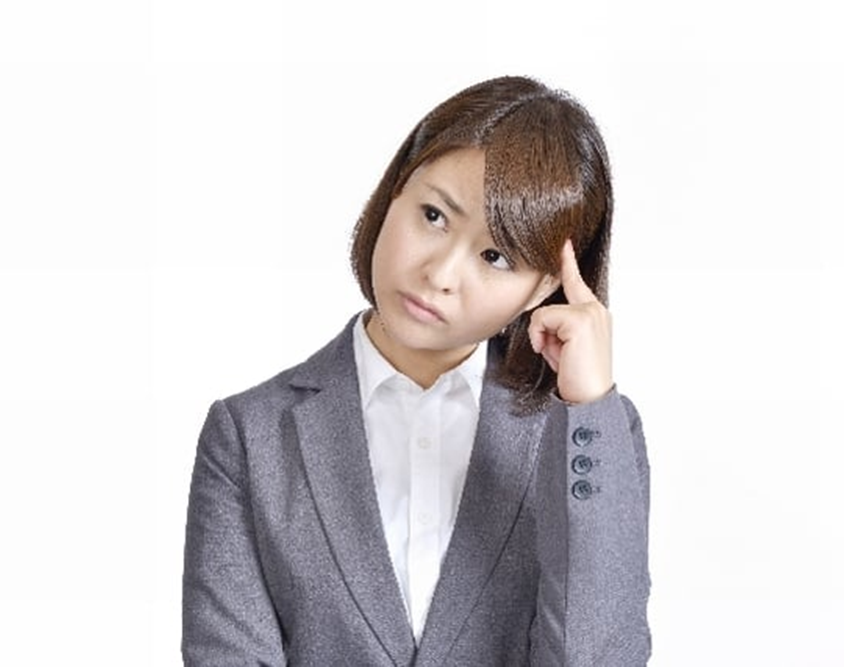 確定申告や税金のことで悩む女性のイメージ写真
